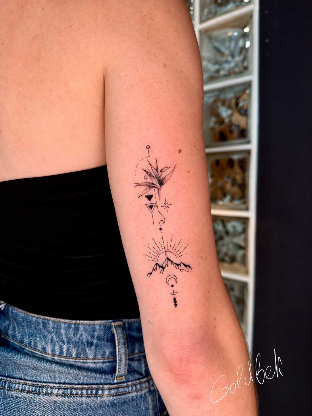 Fine line travel tattoo